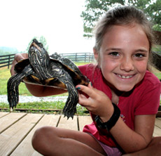 Camper with a turtle at Camp Illahee