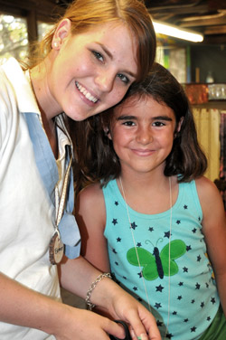 Camp Illahee counselor and camper making crafts project