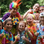 rainbow clad campers pose before competing in the Illahee Olympics